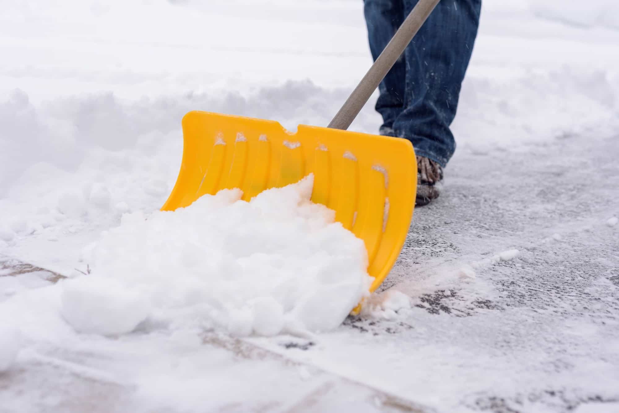 Shoveling snow in winter Commerical snow removal company Boulder Creek Group