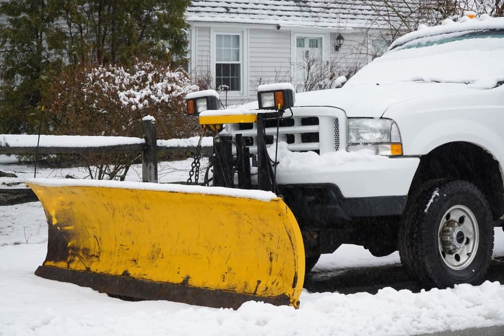 snow plow plowing commercial parking lot Snow Removal Company